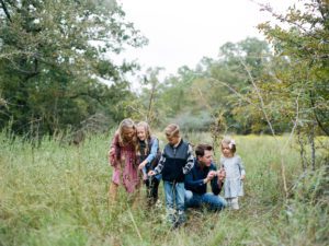 natural photo of family in nature interacting together