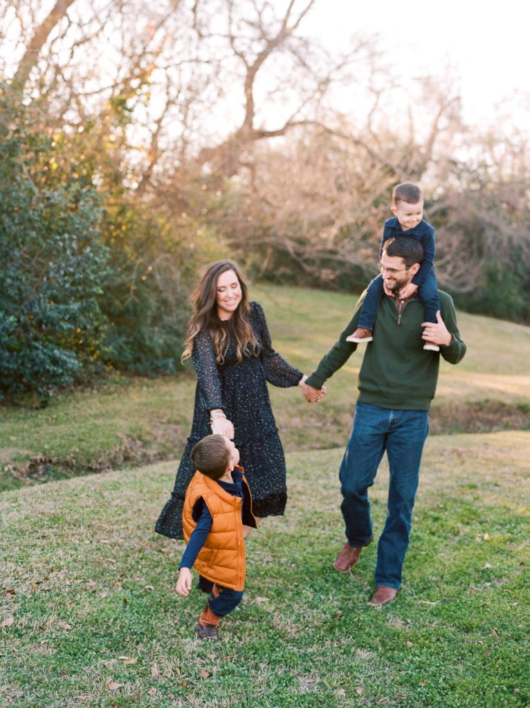 playful family photo walking pose college station