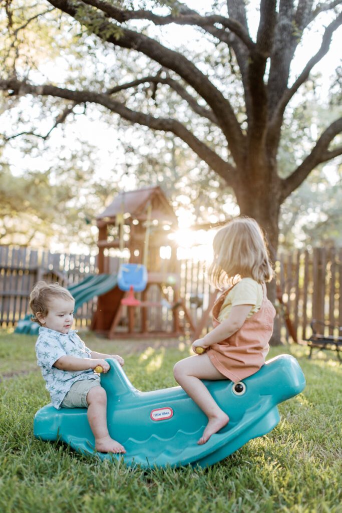 Natural College Station Family Photos kids playing in back yard